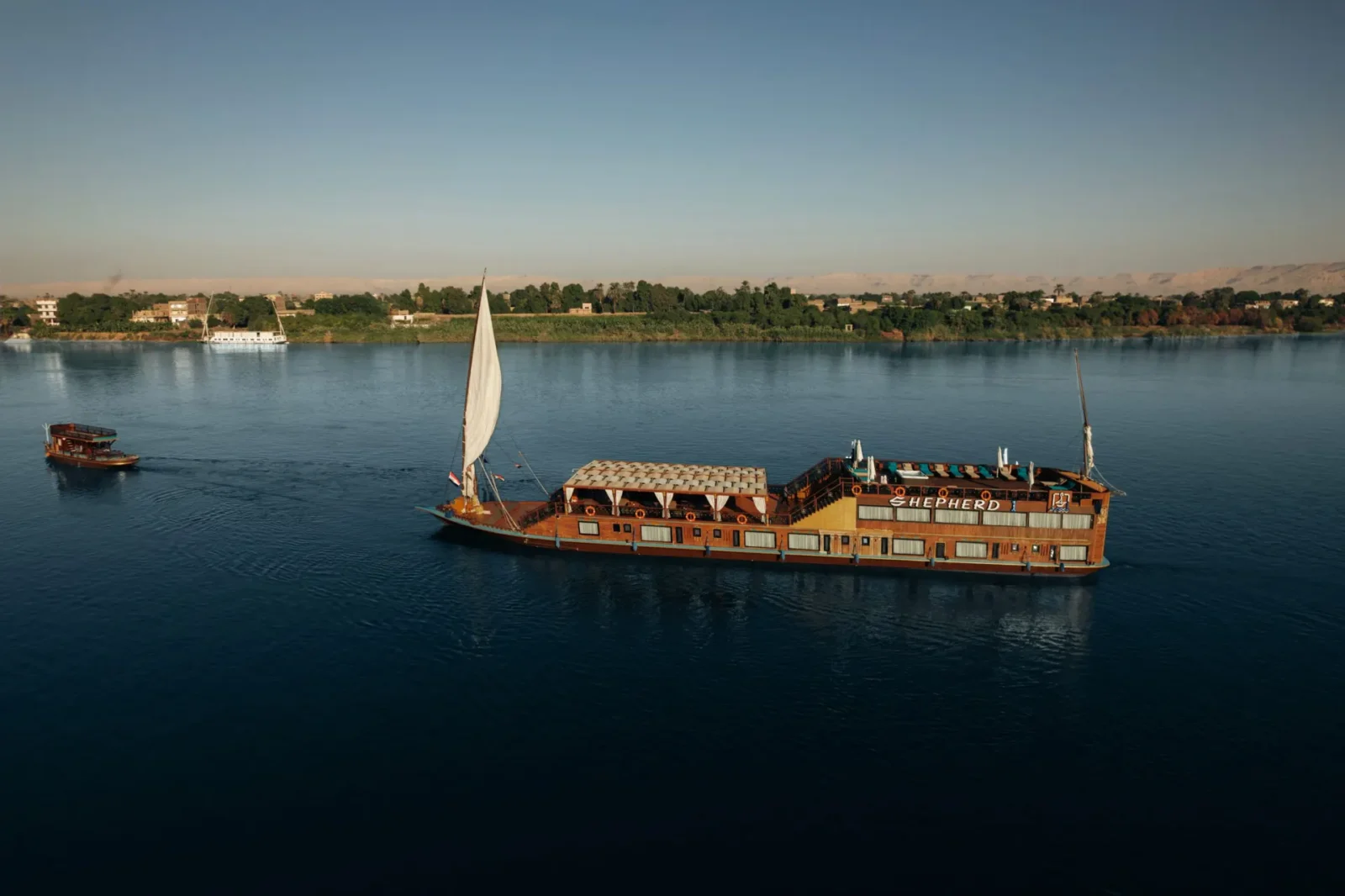 A dahabiya under sail on the Nile