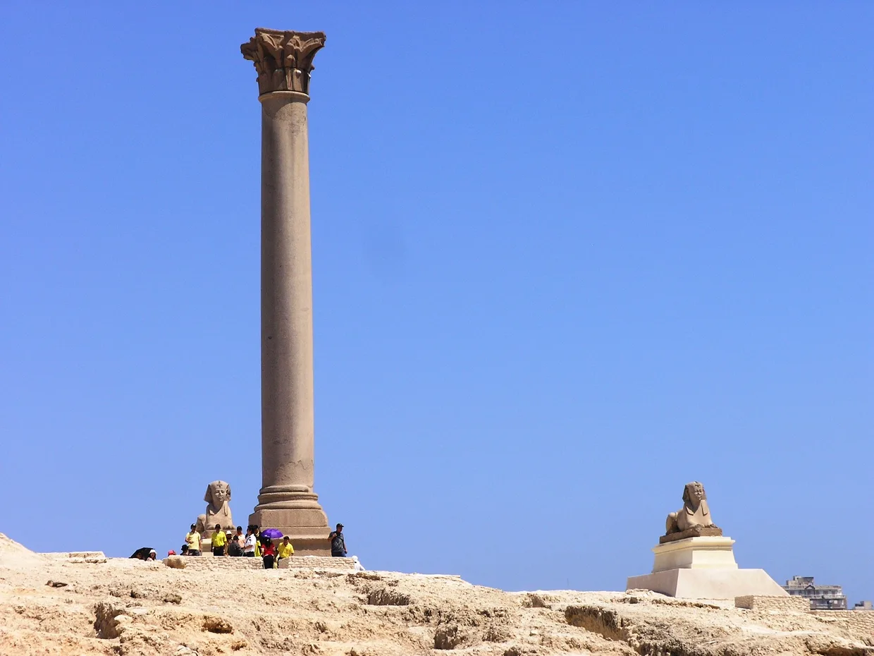 Pompey’s Pillar, a tall polished granite column with a sphinx at its base.