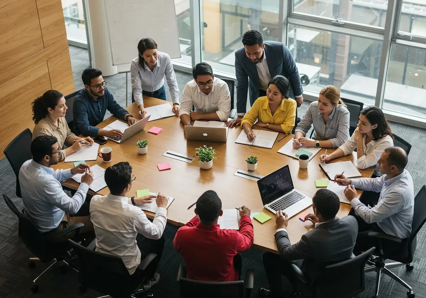 A team gathered around a large table in a planning meeting